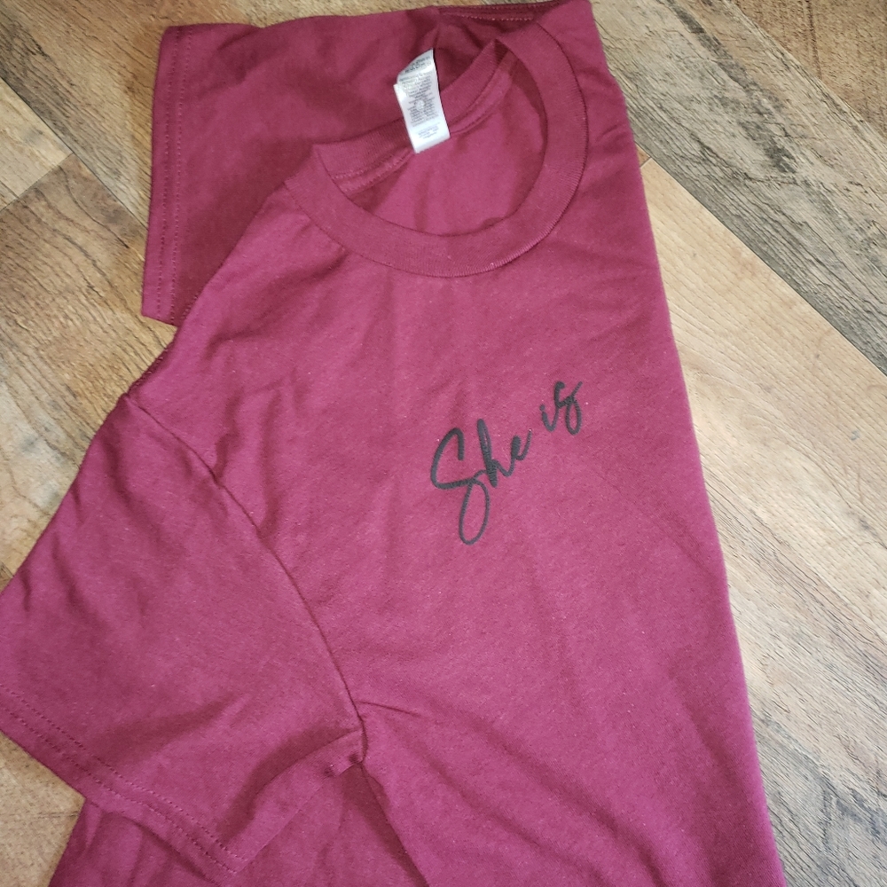 Maroon. Small. Short sleeve. She is...